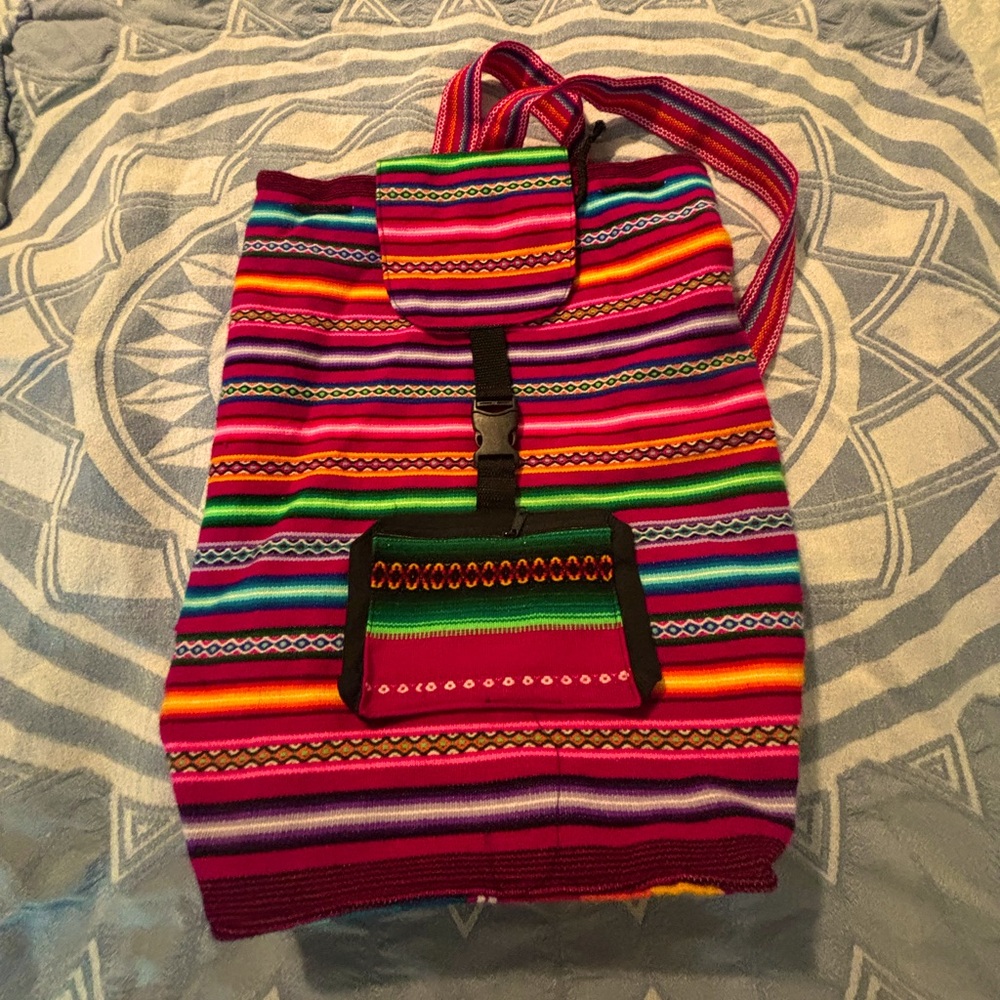 Brightly colored woven backpack. Material feels like a soft wool. Never used.